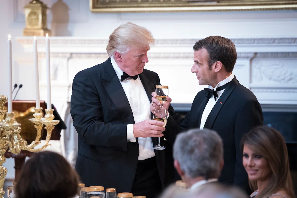 President Donald Trump shares a toast with French President Emmanuel Macron during a state dinner in 2018. (Jabin Botsford/The Washington Post)