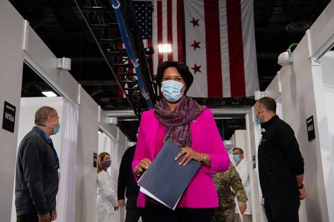 D.C. Mayor Muriel Bowser tours the makeshift hospital last month that has been set up inside the convention center in case hospitals exceed their capacity. (Salwan Georges/The Washington Post)