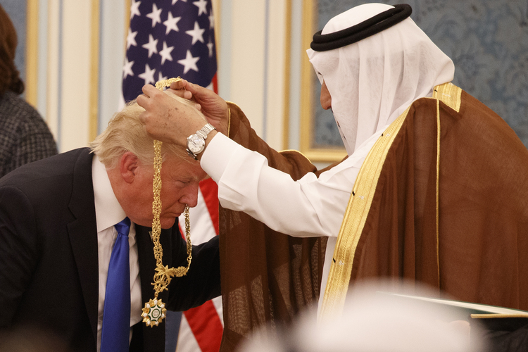 Saudi King Salman presents Trump with the highest civilian honor, the Collar of Abdulaziz Al Saud, at the Royal Court Palace in Riyadh last month. (Evan Vucci/AP)</p>  