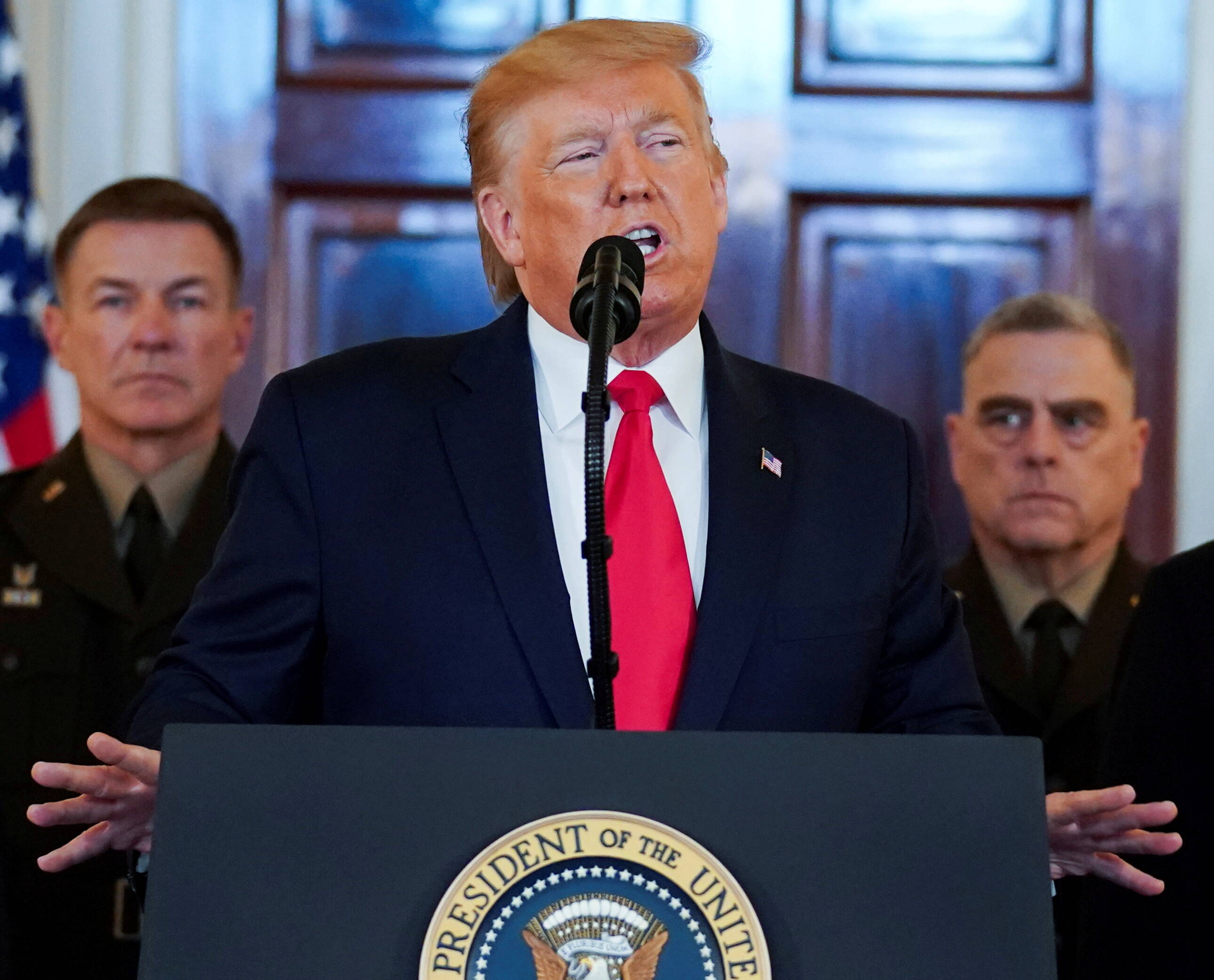 Joint Chiefs of Staff Army General Gen. Mark A. Milley, right, listen to Trump in January 2020. (REUTERS/Kevin Lamarque)