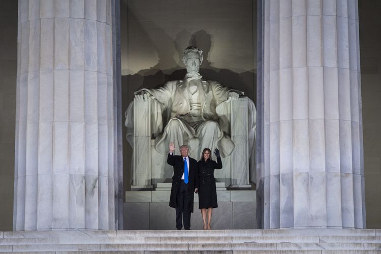 Donald Trump makes a dramatic entrance&nbsp;from inside the Lincoln Memorial during a "Make America Great Again" concert the night before his inauguration. (Jabin Botsford/The Washington Post)</p>  