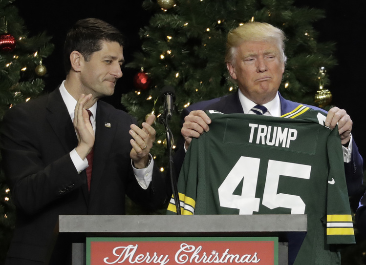 Paul Ryan gave then President-elect Trump a Green Bay Packers jersey during a "thank you"&nbsp;rally last December in West Allis, Wis. (Morry Gash/AP)</p>  
