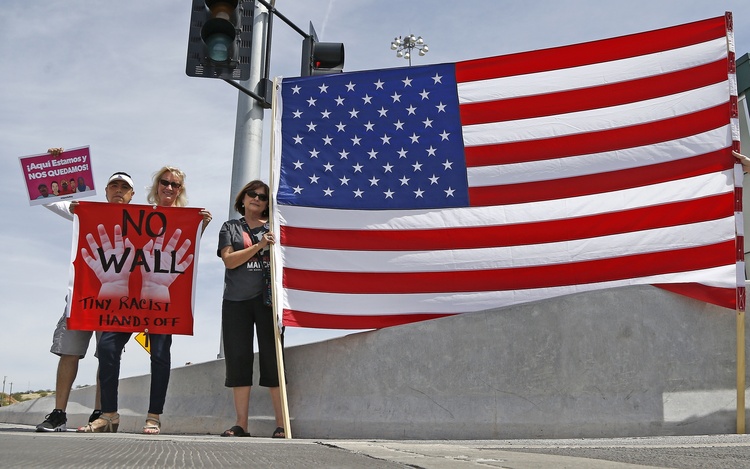 Protesters gather outside of a news conference where Jeff Sessions spoke after he toured the U.S.-Mexico border. (AP/Ross D. Franklin)</p>  