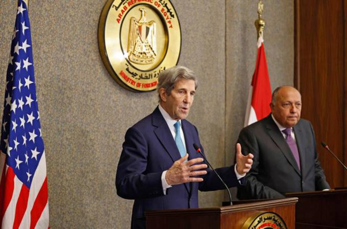 U.S. climate envoy John F. Kerry, left, and Egyptian Foreign Minister Sameh Shoukry at a news conference in Cairo on Feb. 21. (Khaled Desouki/AFP/Getty Images)