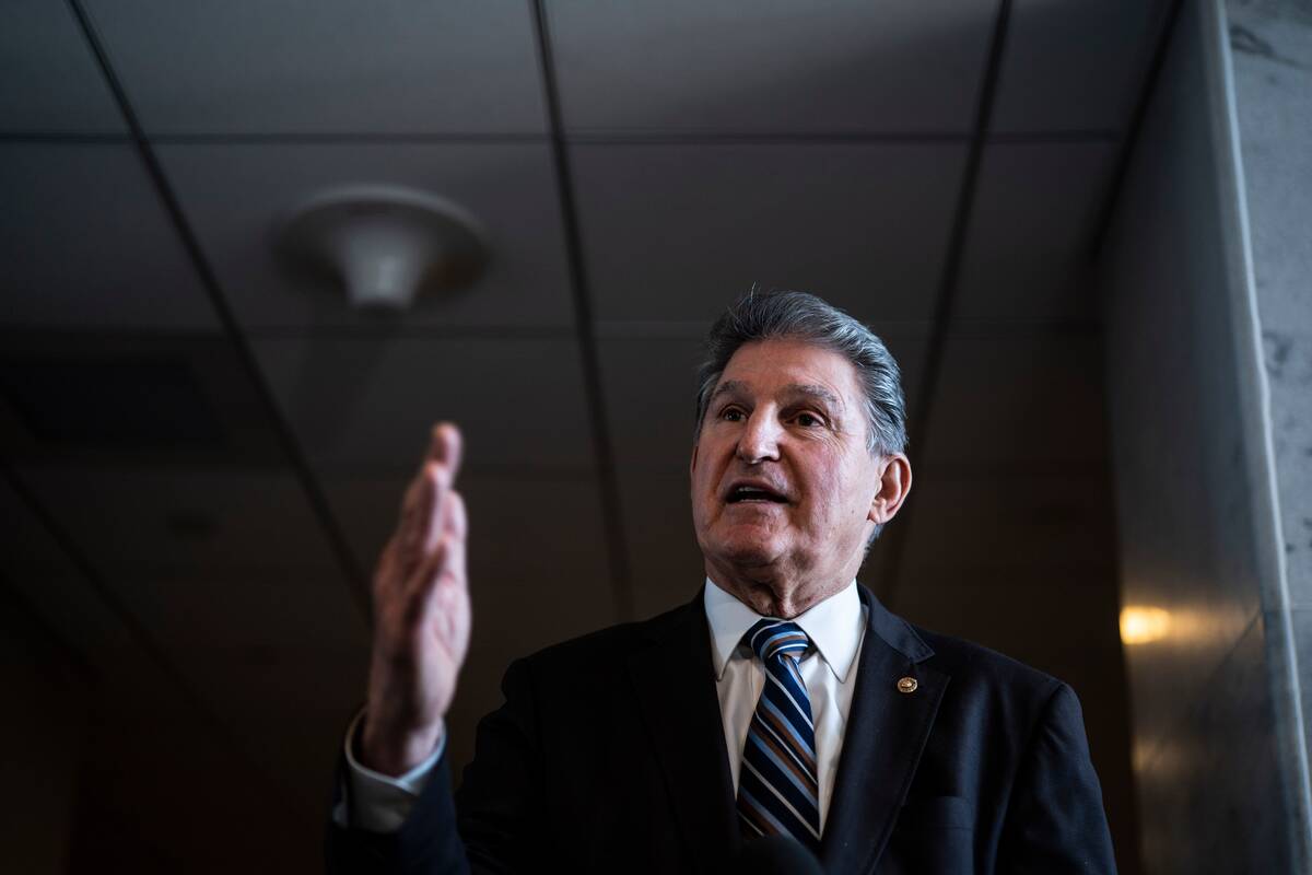 Sen. Joe Manchin III (D-W.Va.) speaks with reporters outside his Capitol Hill office on Jan. 4. (Jabin Botsford/The Washington Post)