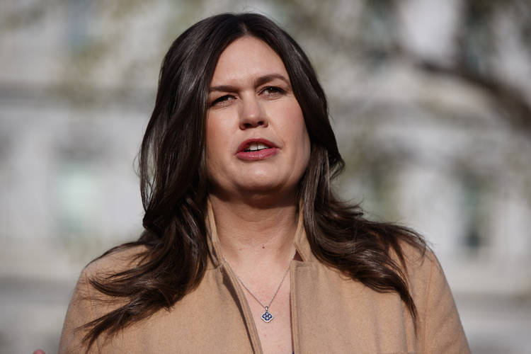 White House press secretary Sarah Sanders talks with reporters outside the White House earlier this month. (Evan Vucci/AP)  