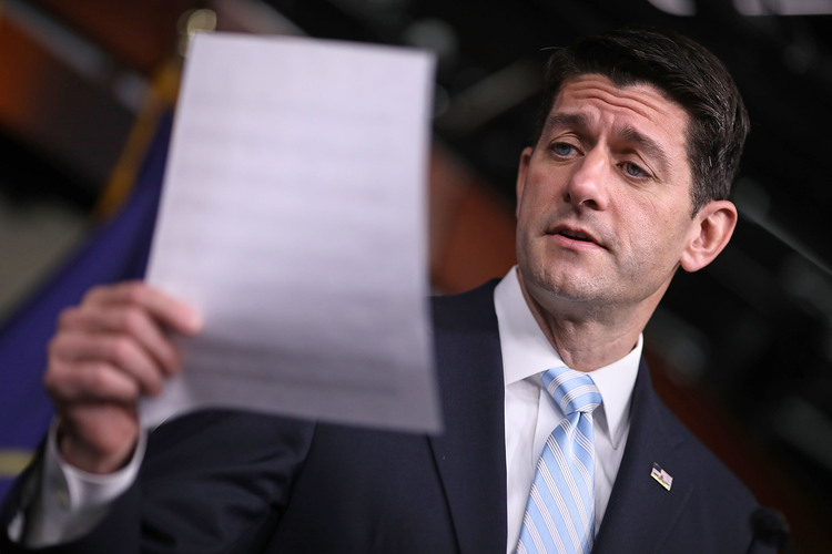 Paul Ryan reads&nbsp;a list of states with increasing health insurance premiums during a news conference. (Chip Somodevilla/Getty)</p>  