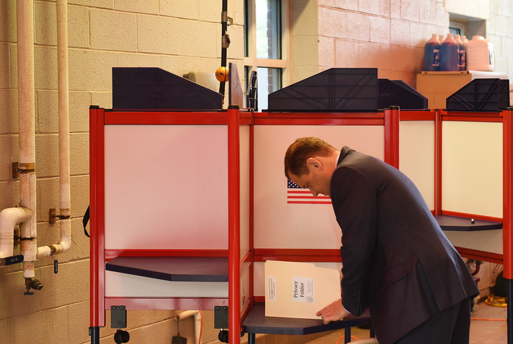 Tom Perriello, one of the two Democratic candidates for governor in Virginia, votes this morning at the Fire Department Headquarters in Alexandria. (Photo by Astrid Riecken For The Washington Post)</p>  