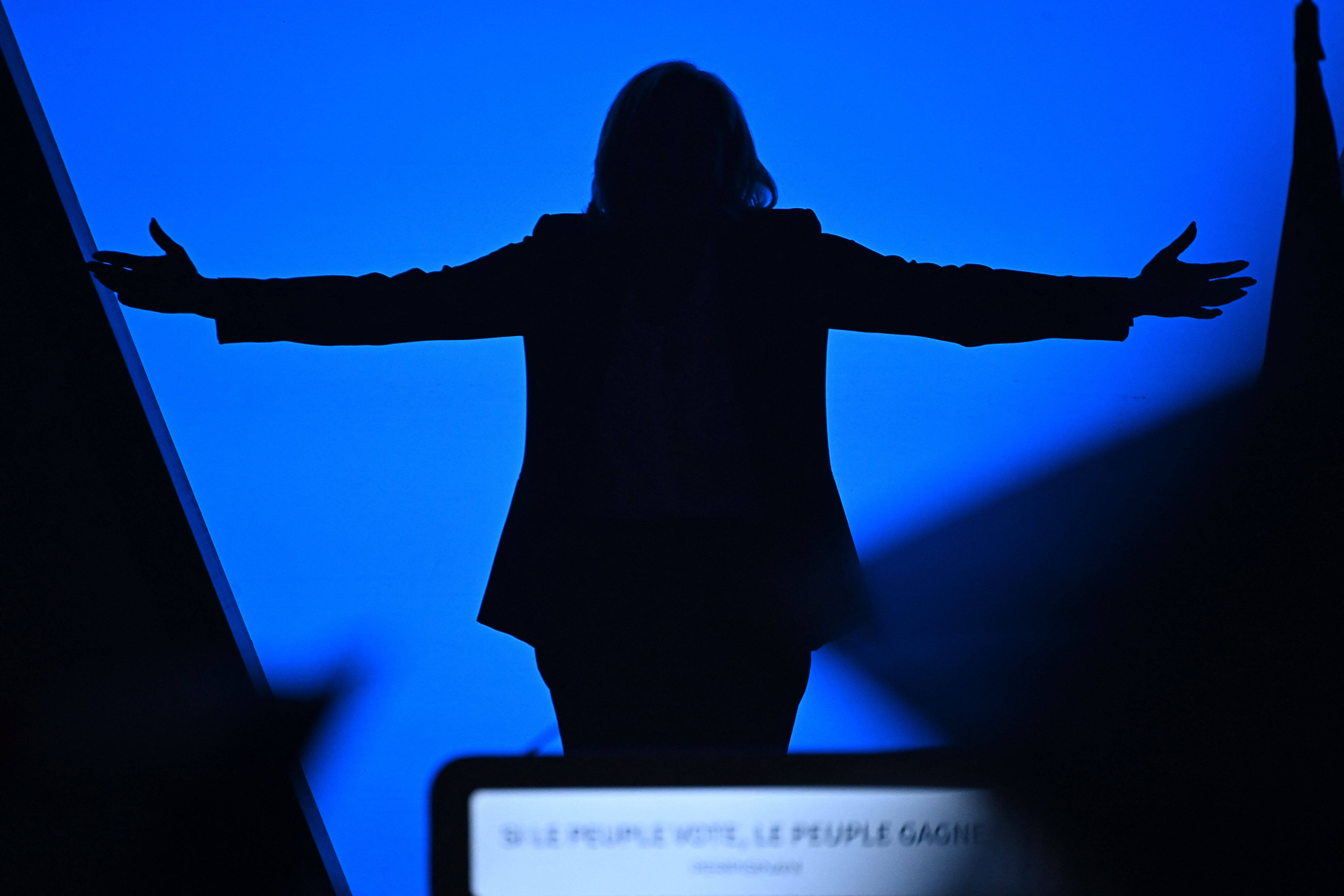 French presidential candidate Marine Le Pen is seen in silhouette as she holds a campaign rally in Perpignan, France, on April 7. (Lionel Bonaventure/AFP/Getty Images)