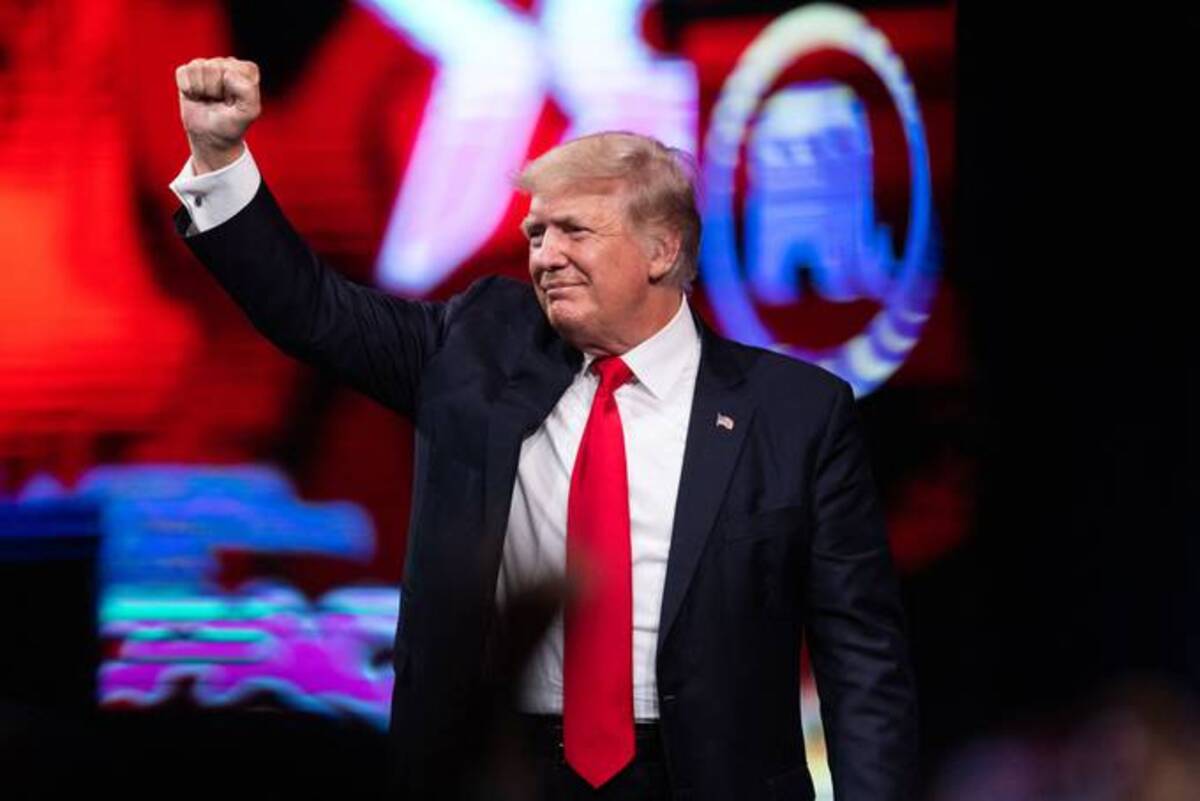 Trump pumps his fist as he walks off after speaking at the Conservative Political Action Conference (Andy Jacobsohn/AFP via Getty Images)