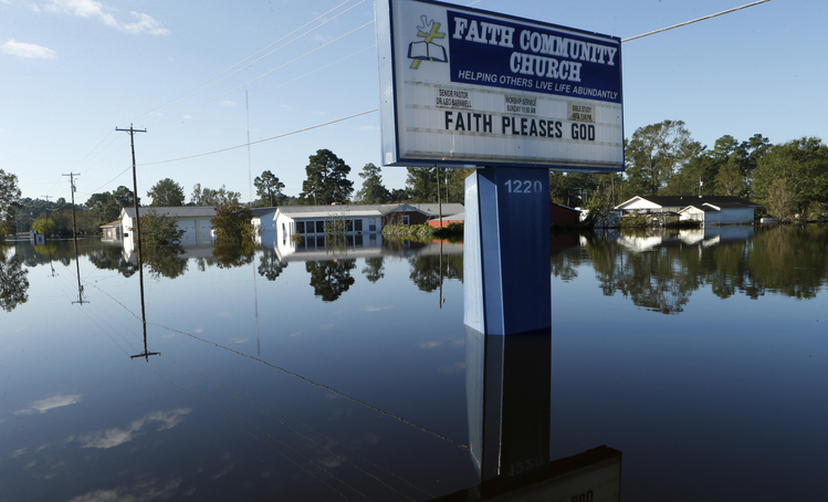 Floodwaters in the aftermath of Hurricane Matthew. (AP Photo/Brian Blanco)</p>