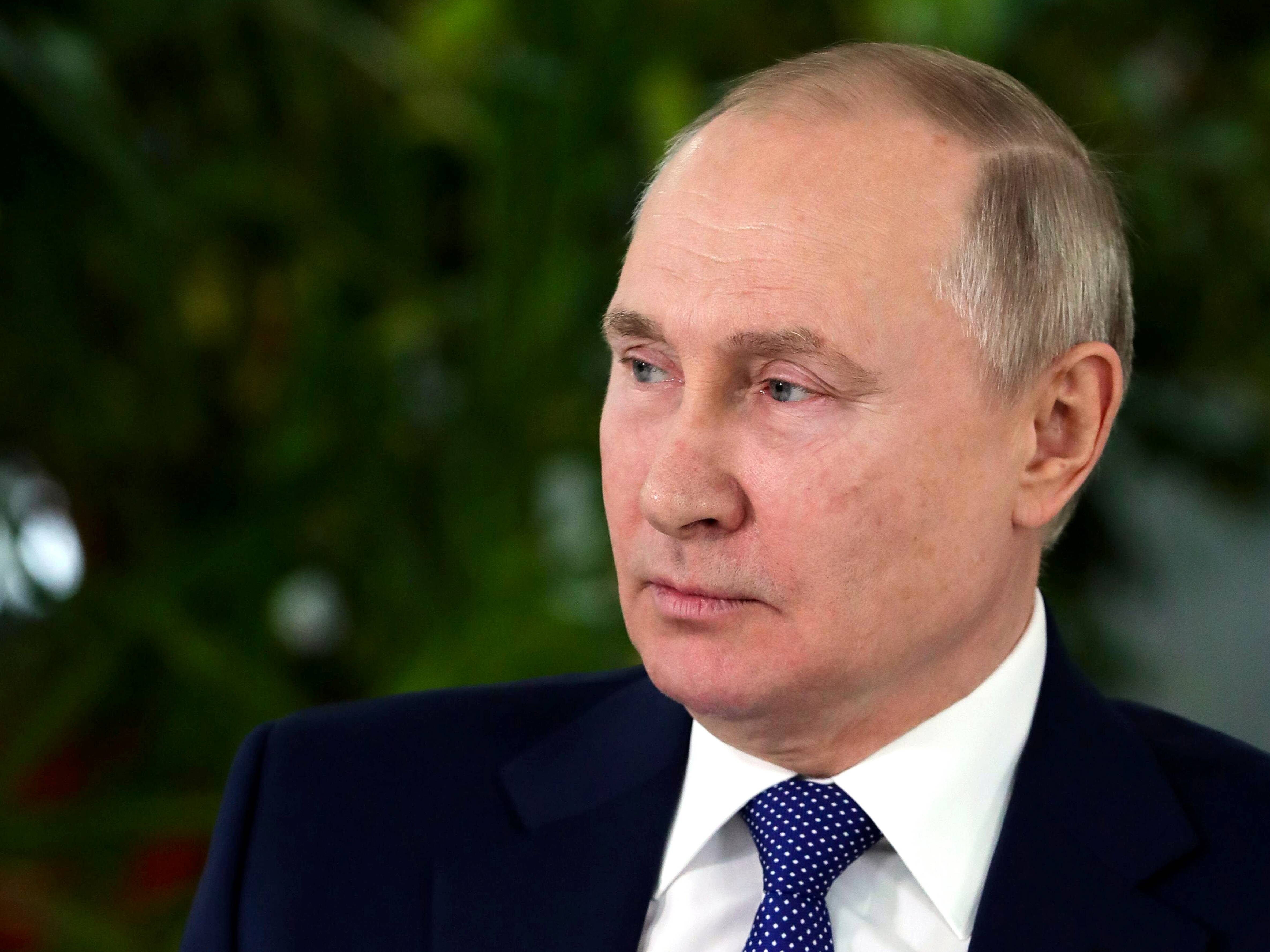 Russian President Vladimir Putin speaks to representatives of the flight crew of Russian airlines as he visits Aeroflot Aviation School outside Moscow on March 5. (Mikhail Klimentyev/AP)