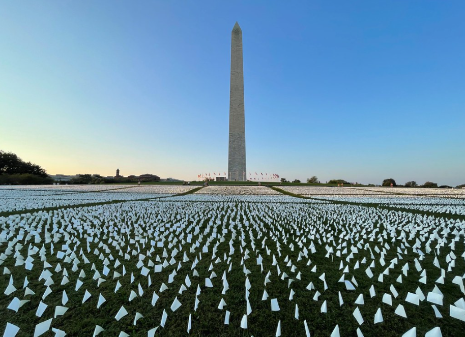 Flags adorn the National Mall on Sunday to commemorate the American lives lost to covid-19.