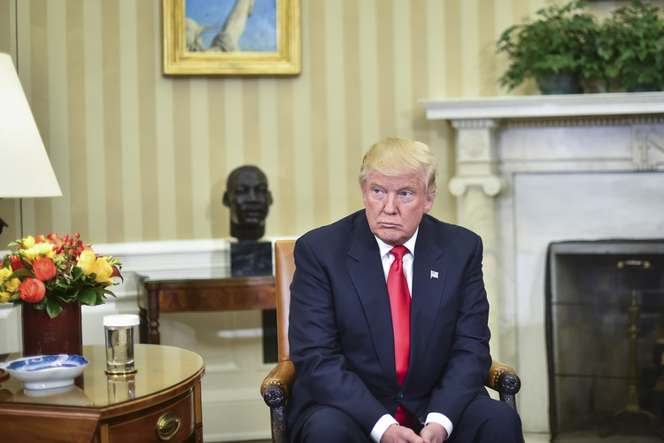 Donald Trump listens as Barack Obama talks to the media in the Oval Office the Thursday after the election. (Jabin Botsford/The Washington Post)</p>  