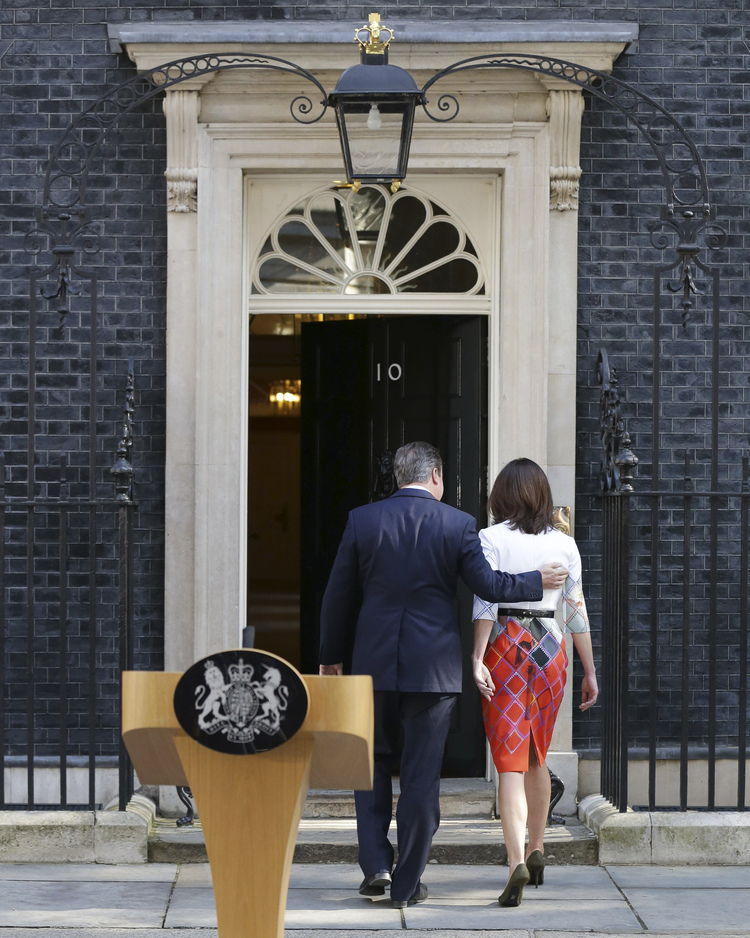 British Prime Minister David Cameron puts his arm around his wife Samantha after announcing his resignation at 10 Downing Street in London after the country voted to leave the E.U. (Daniel Leal-Olivas/PA via AP)</p>  