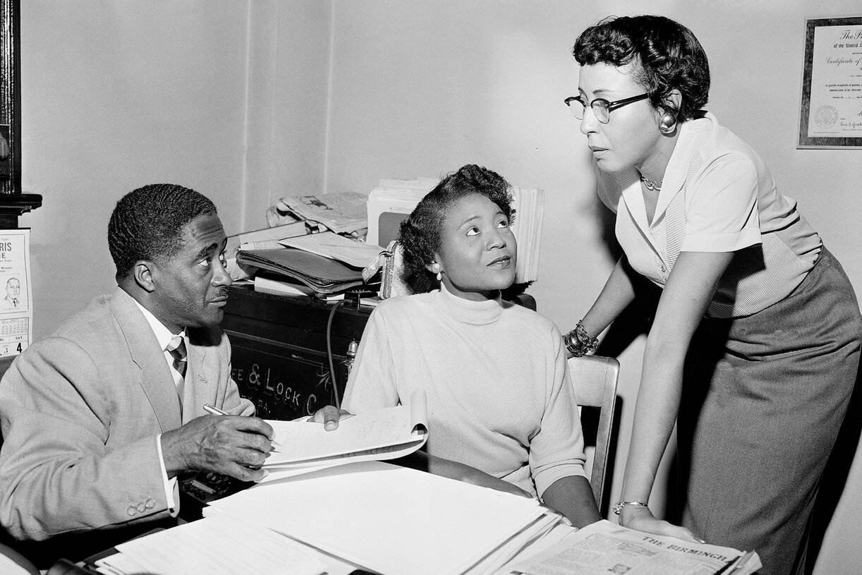 Autherine Lucy Foster, center, discusses her return to the University of Alabama following mob demonstrations in 1956. (Gene Herrick/AP)