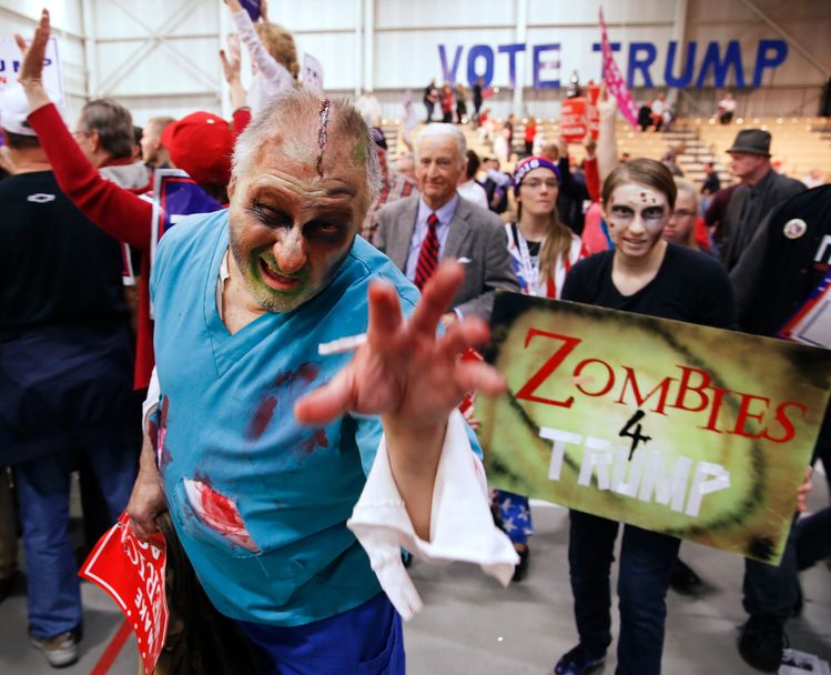 On Halloween, supporters of Donald Trump dressed up as zombies mugged for the camera following his rally in Macomb County, Michigan. (Jeff Kowalsky/AFP/Getty)</p>  