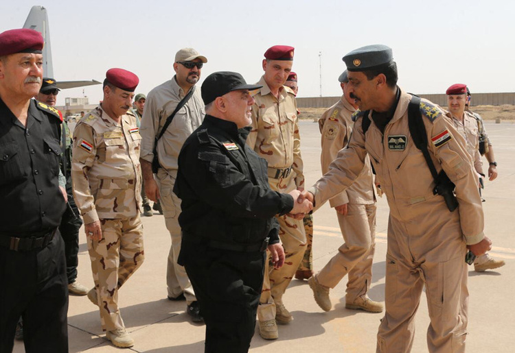 Iraqi Prime Minister Haider al-Abadi greets army officers in Mosul. (Iraqi Prime Minister's Office/HO/AFP)  