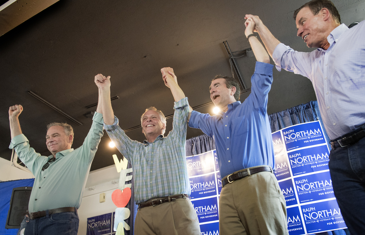 Tim Kaine, Terry McAuliffe, Ralph Northam and Mark Warner campaign together in Arlington on Saturday. (Linda Davidson/The Washington Post)</p>  