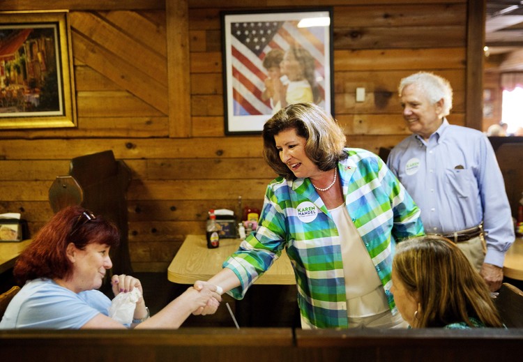 Republican candidate Karen Handel greets diners yesterday during a campaign stop at Old Hickory House in Tucker, Ga. (David Goldman/AP)</p>  
