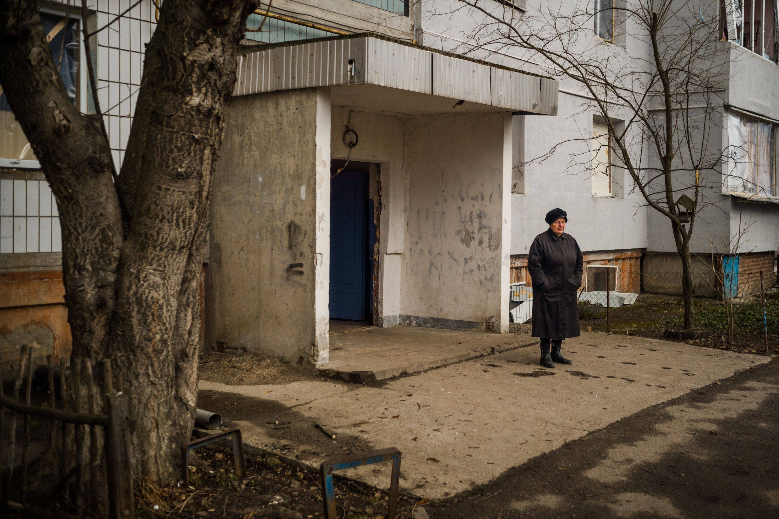 Hanna Petrivna on March 4 outside a building damaged by bombing in Bila Tserkva. (Wojciech Grzedzinski for The Washington Post)
