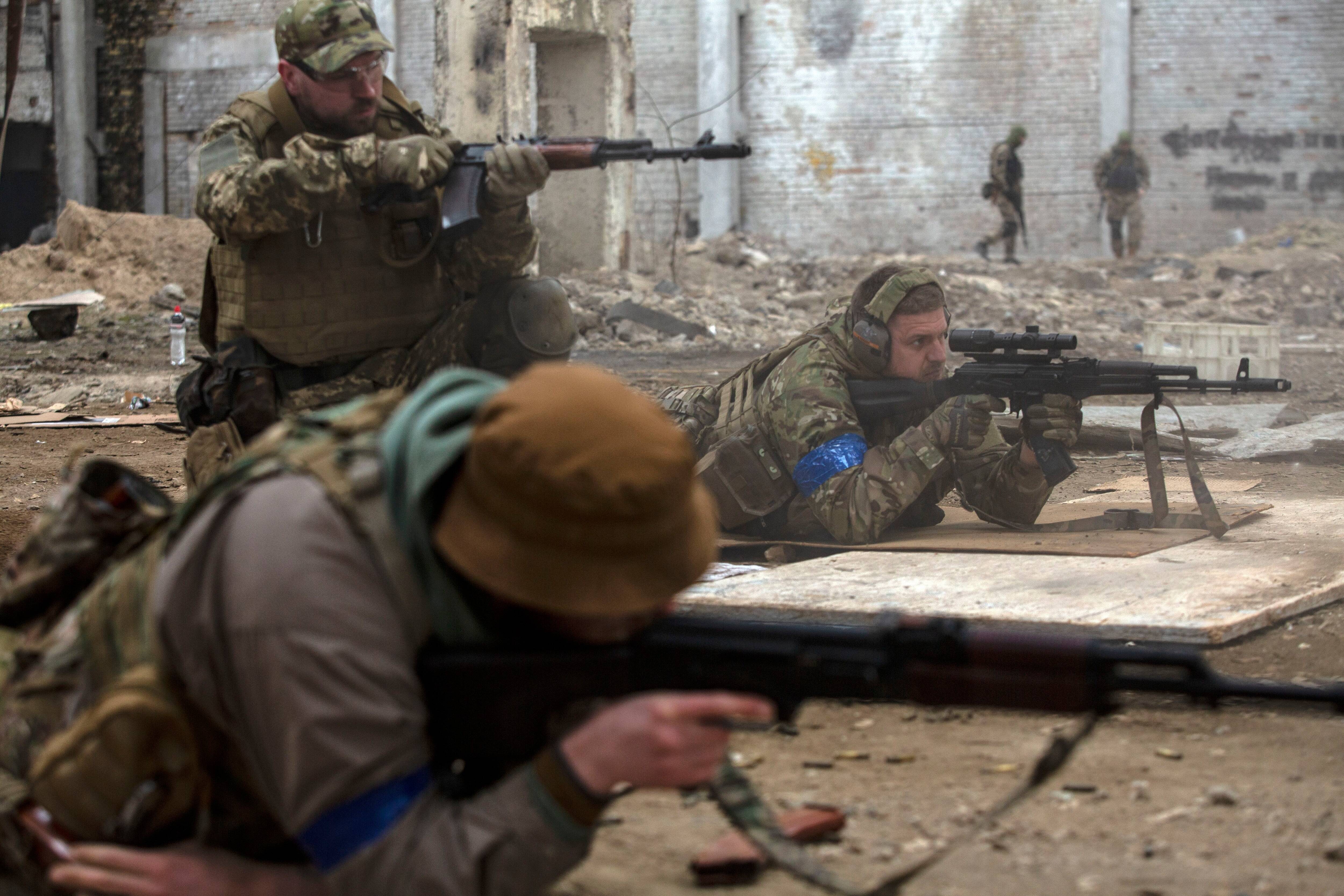 Ukrainian members of the Azov Battalion as they practice shooting live bullets at a training site in Kyiv on March 24. (Heidi Levine for The Washington Post)