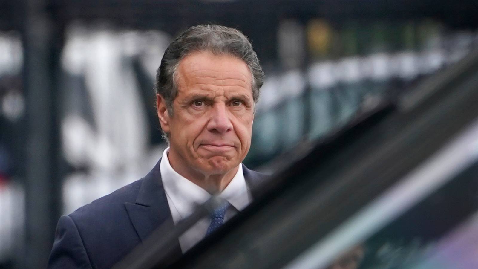 New York Gov. Andrew M. Cuomo prepares to board a helicopter after announcing his resignation Tuesday. (Seth Wenig/AP)