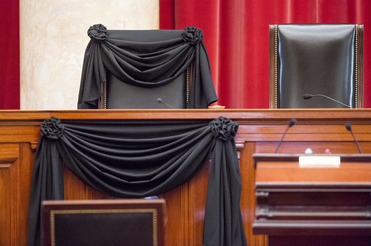 The bench chair of late Supreme Court Justice Antonin Scalia is draped in black wool crepe, a tradition dating back to 1873.&nbsp;(EPA/Michael Reynolds)</p>  