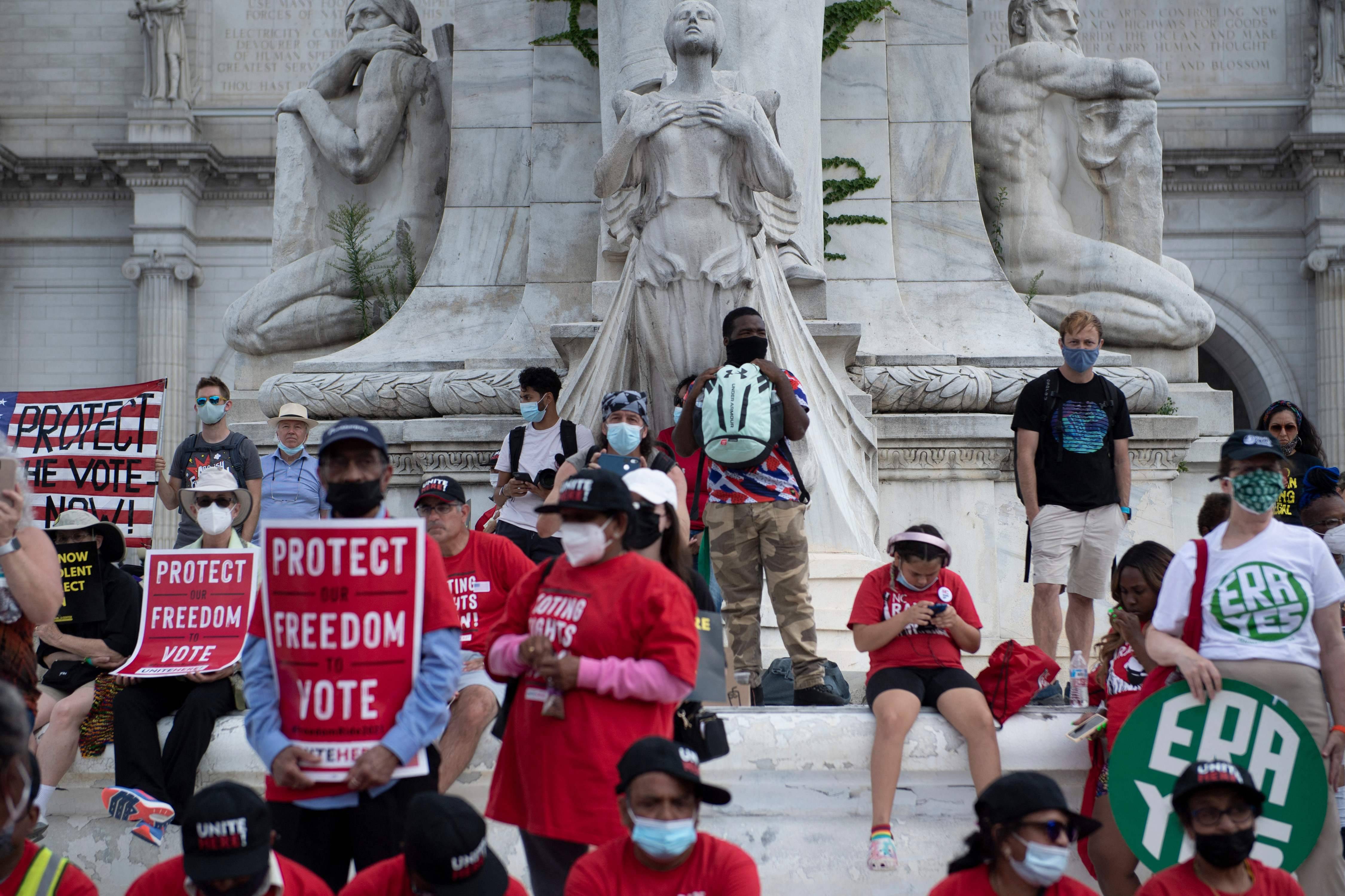 People gather near the U.S. Capitol on Monday to push Congress to pass voting rights laws. (Brendan Smialowski/AFP via Getty Images)