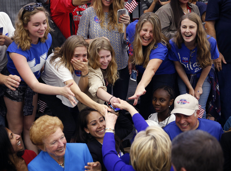 Hillary works the rope line in Long Beach yesterday.&nbsp;(AP Photo/John Locher)</p>  