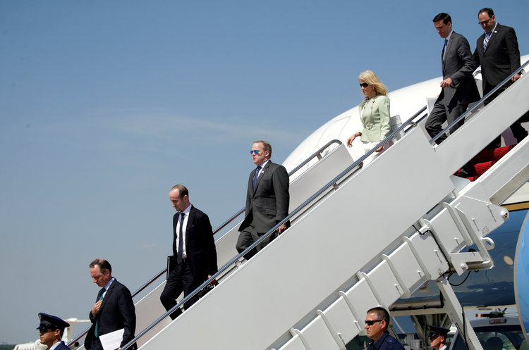 Trump staffers depart from Air Force One together at Joint Base Andrews.&nbsp;(Reuters/Kevin Lamarque)</p>  