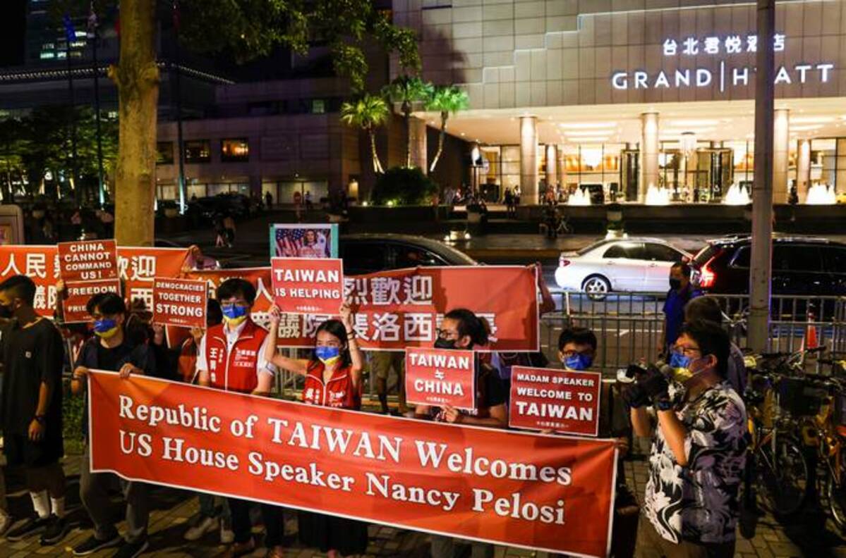 Protesters gather outside the Grand Hyatt hotel in Taipei, Taiwan, to support the visit of House Speaker Nancy Pelosi (I-Hwa Cheng/Bloomberg News)