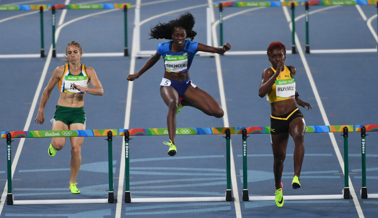 Team USA's Ashley Spencer wins her heat in the 400m hurdle semifinal yesterday. (Jonathan Newton/The Washington Post)</p>