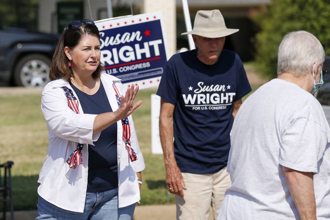 Susan Wright greets voters during early voting for a special runoff election on July 22 in Arlington, Texas. (Elias Valverde II/The Dallas Morning News via AP)