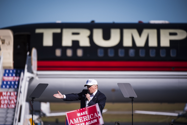 Trump speaks during on Friday in Wilmington, N.C. (Jabin Botsford/The Washington Post)</p>  