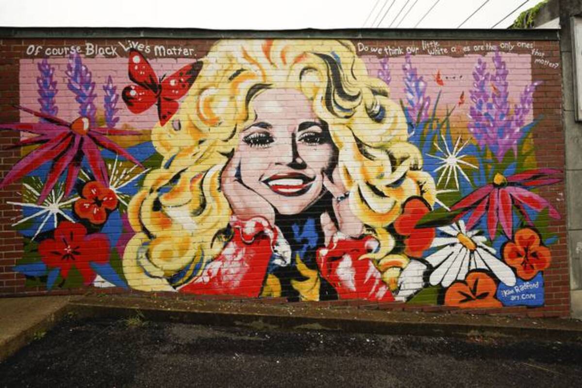 A mural of Dolly Parton is seen outside The 5 Spot, a music club in Nashville, Tenn. (Mark Humphrey/AP)