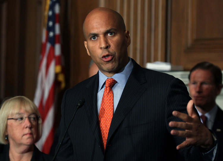 Cory Booker works the Hill.&nbsp;(AP Photo/Lauren Victoria Burke)</p>  