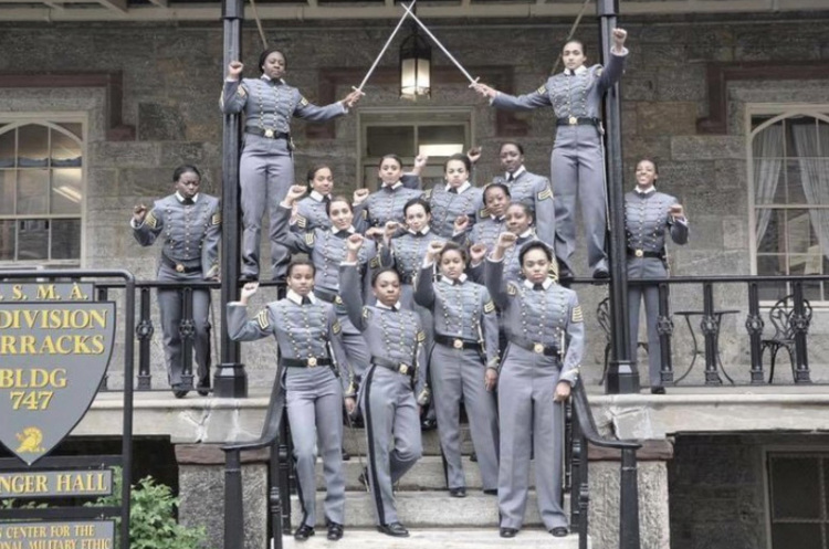 An image posted to&nbsp;Twitter shows 16 African American, female&nbsp;cadets in uniform with their fists raised. These women are poised to graduate on May 22.&nbsp;(Obtained from Twitter via AP)</p>  