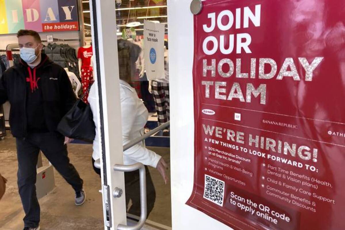 Holiday hiring sign is displayed at a retail store in Vernon Hills, Ill., &nbsp;on Nov. 13, 2021. (Nam Y. Huh/AP)