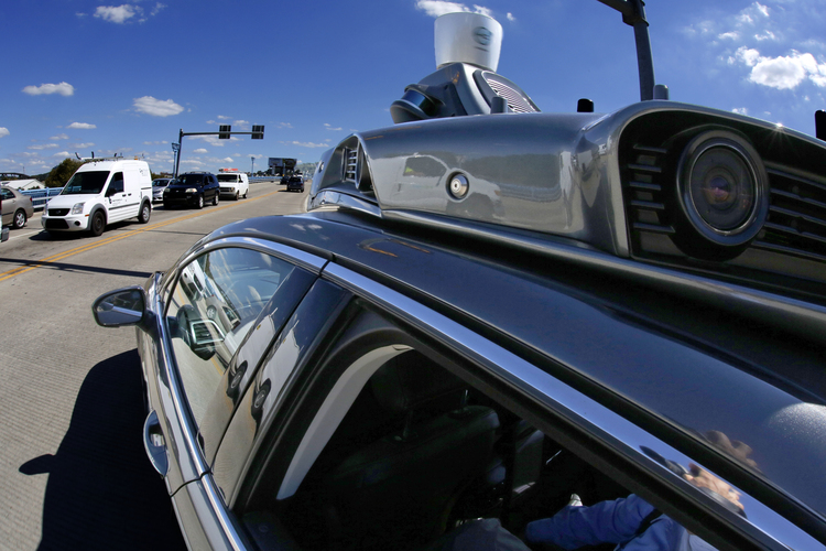 A self driving Uber turns onto the 31st street bridge in Pittsburgh.&nbsp;(AP/Gene J. Puskar)</p>  
