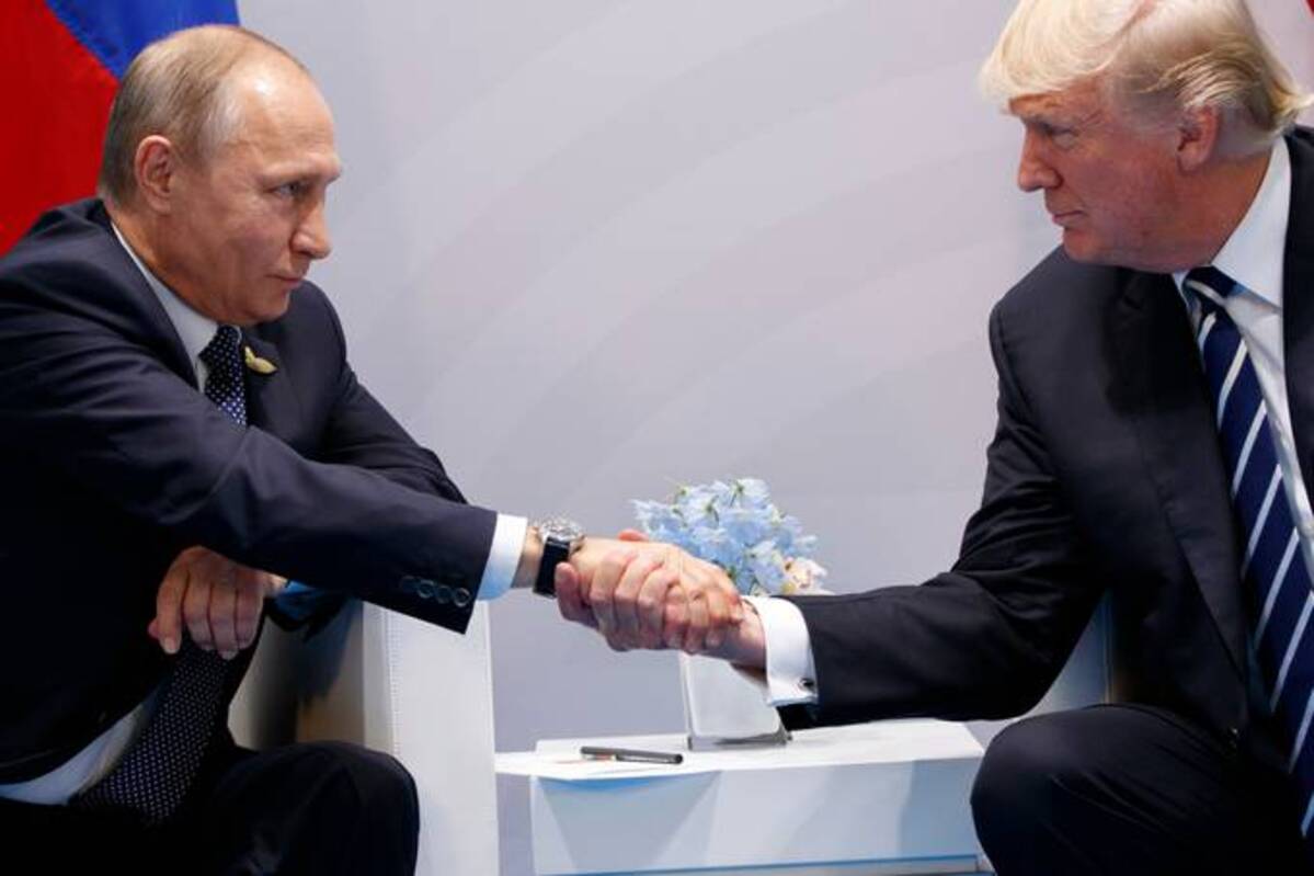 President Donald Trump shakes hands with Russian President Vladimir Putin at the Group of 20 summit in Hamburg on July 7, 2017. (Evan Vucci/AP)