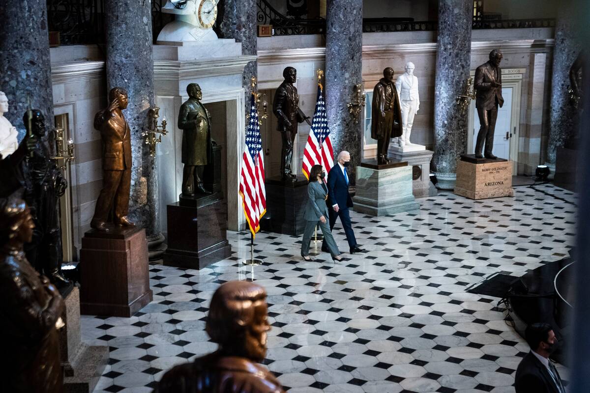 President Biden and Vice President Harris arrive to deliver remarks from Statuary Hall to mark the one year anniversary of the Jan. 6 Capitol insurrection. (Jabin Botsford/The Washington Post)