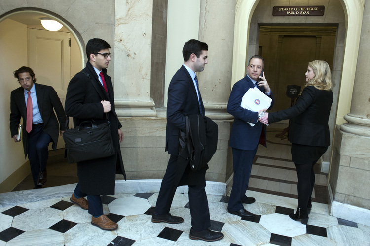 Reince Priebus leads other Trump advisers into a meeting with Paul Ryan at the Capitol. (Cliff Owen/AP)</p>