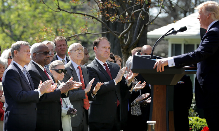 John Roberts, Clarence Thomas, Ruth Bader Ginsburg, Stephen Breyer and Samuel Alito applaud for Trump during the ceremony where Neil Gorsuch took the judicial oath in the Rose Garden last month. (Chip Somodevilla/Getty Images)</p>  