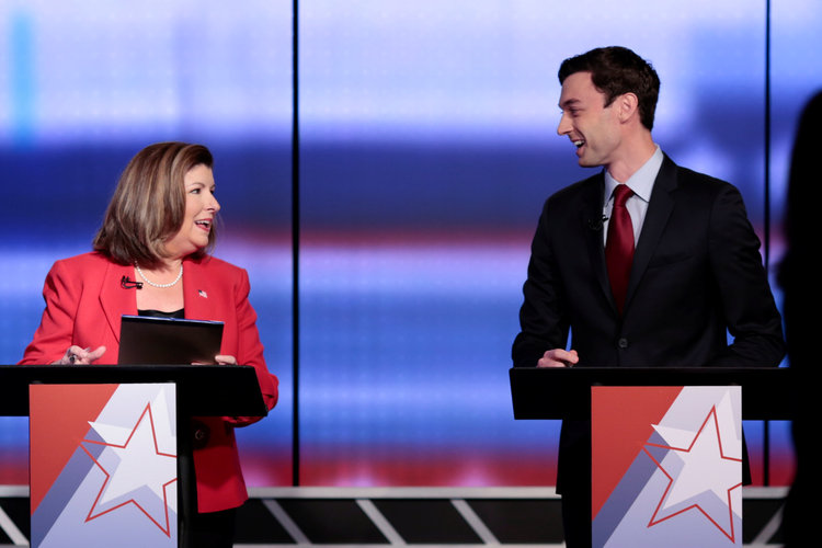 Karen Handel and Jon Ossoff&nbsp;debate on June 6. (Chris Aluka Berry/Reuters)</p>  