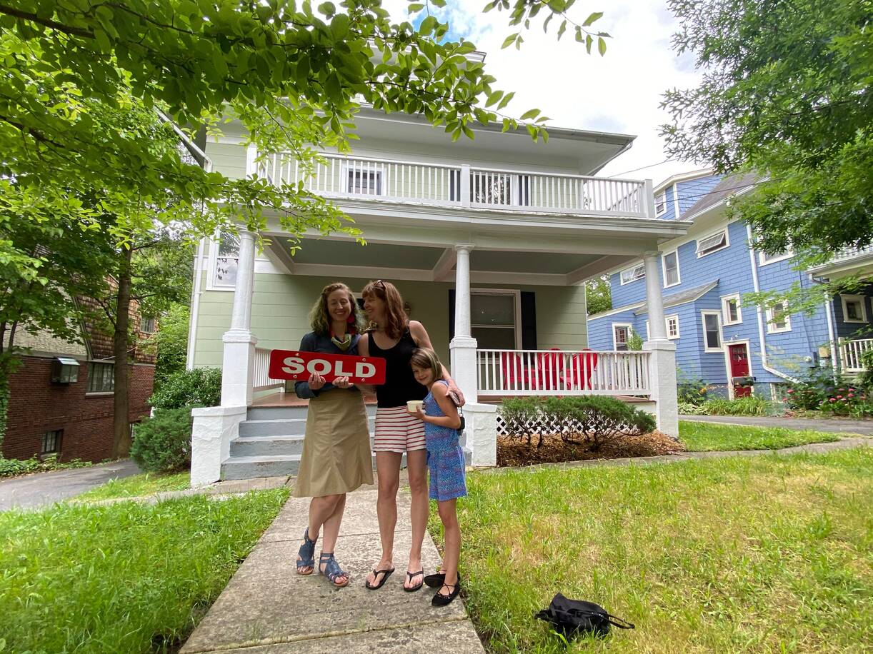 Herrin Hopper, left, with Holly Harper and Harper's 9-year-old daughter, Madeline, after the two women purchased a home in Takoma Park together in April 2020. (Courtesy of Holly Harper)