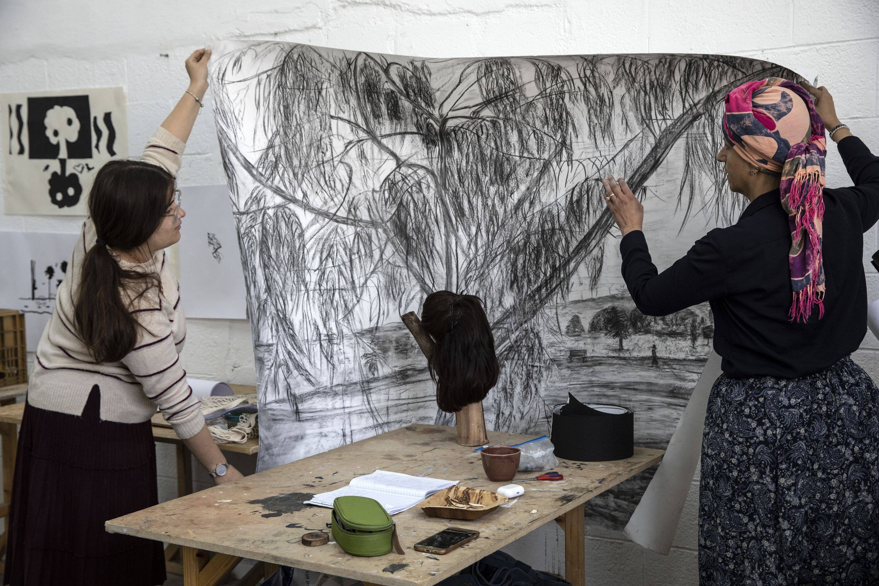 Michal Rosenfield shows one of her sketches of trees at the Haredi Branch of the Bezalel Academy of Arts in Jerusalem on Dec. 8. (Heidi Levine for The Washington Post).