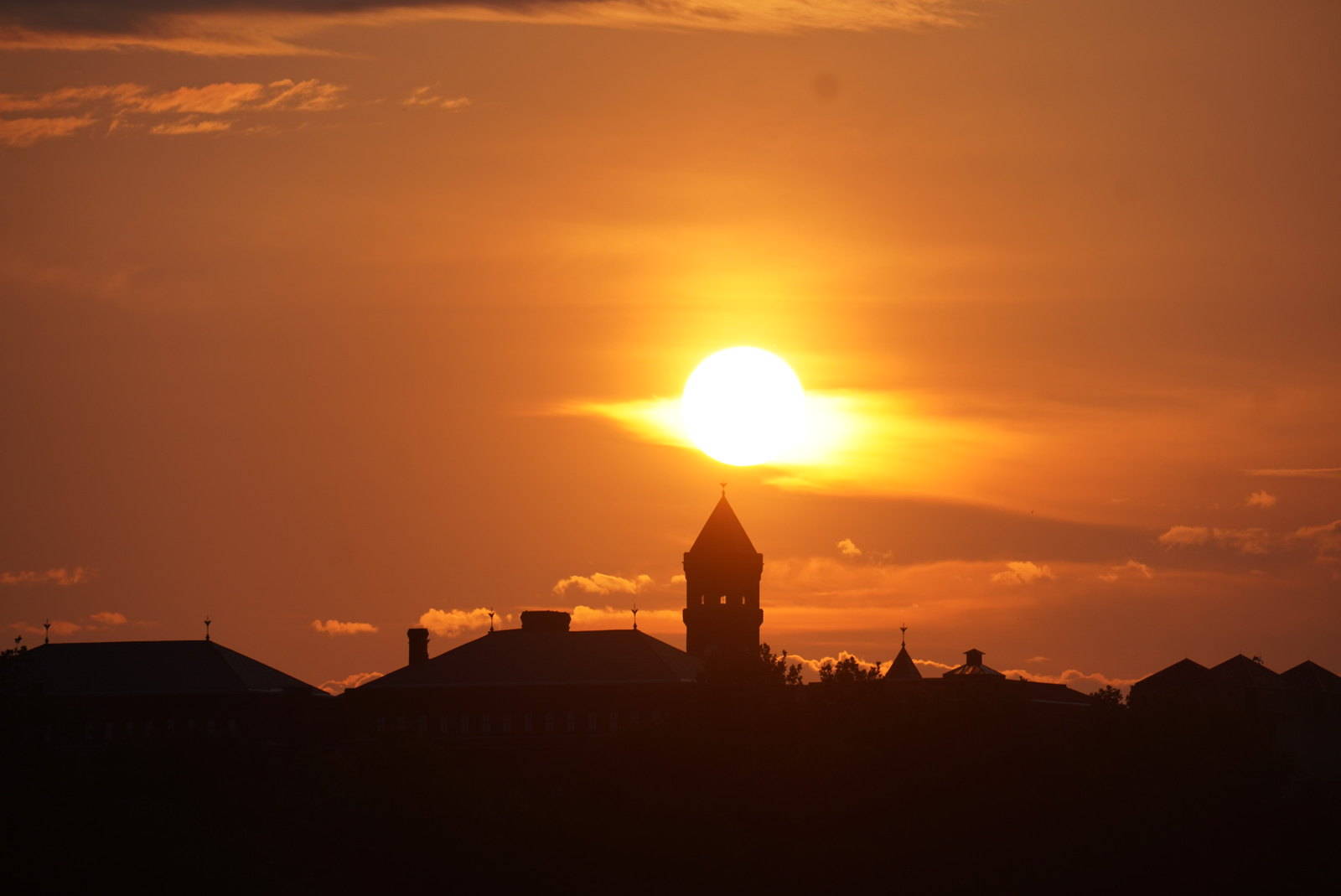 The sun rises on a hot Friday in the city. (Jeannie In D.C./Flickr)