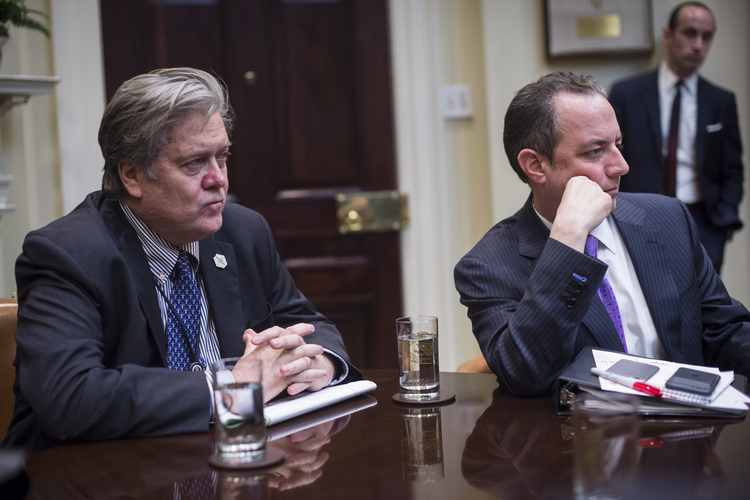 Steve Bannon, left, and Reince Priebus, right, listen during a meeting at the White House. (Jabin Botsford/The Washington Post)</p>  