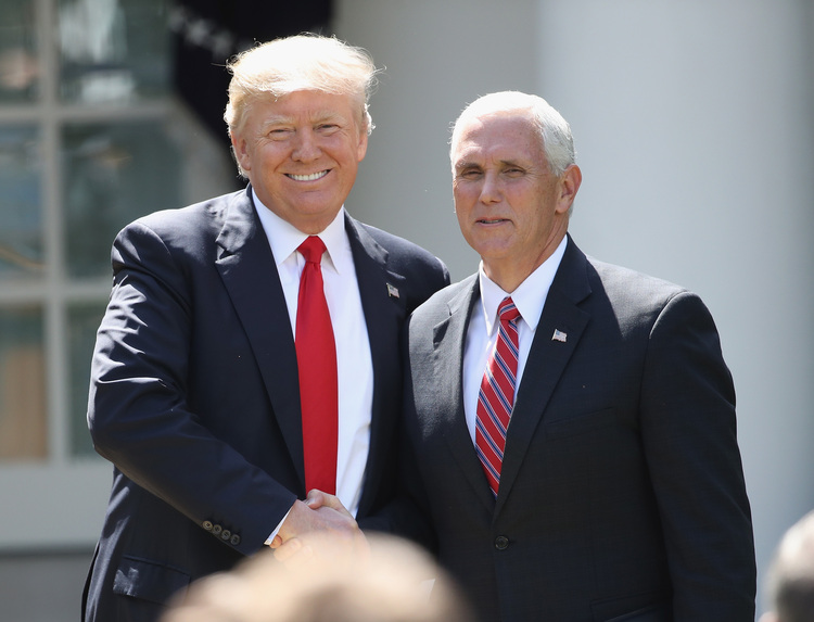 President Trump shakes hands with Vice President Pence. (Win McNamee/Getty Images)  